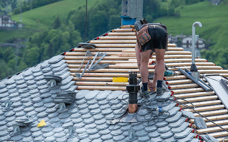 Residential roof installation by Global Home Improvements, showing roofing materials and construction process.