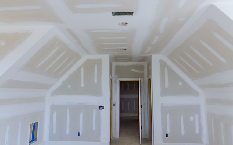 Closeup view of drywall installation process, part of home improvement services offered by Global Home Improvements.