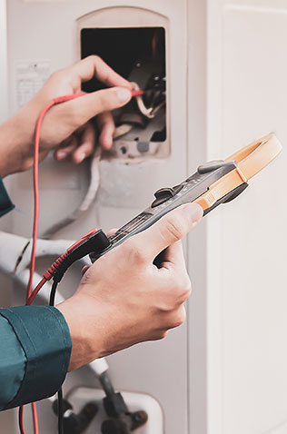 HVAC technician servicing a home heating and cooling system.